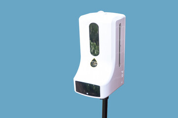 Automatic Alcohol Dispenser at cafe' shop for protect covid19 on blue background with clipping path.