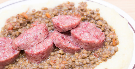 Italian pork sausage served with lentils