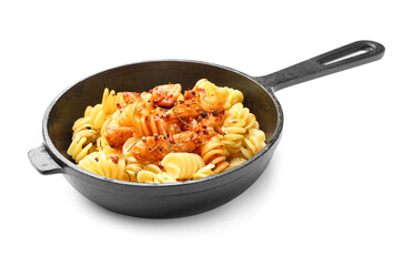 Frying pan with tasty pasta and chicken on white background