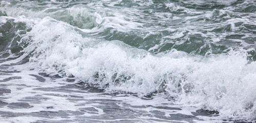Wave in the sea with splashing water.