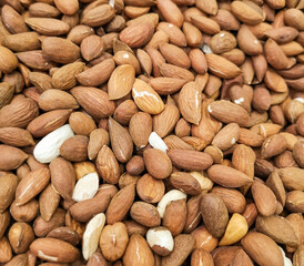 Close up of almond nuts as abstract background.