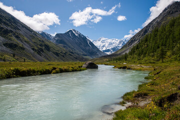 view of the snow-capped Belukha peak from the shore of lake Akkem
