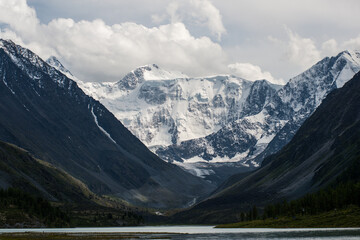 view of the snow-capped Belukha peak from the shore of lake Akkem