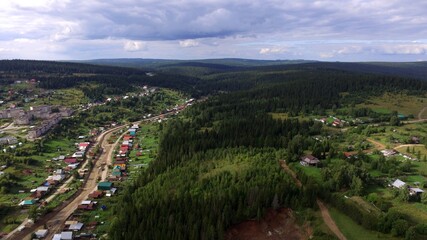 Fototapeta na wymiar A small town of Nizhniye Earrings Sverdlovsk region from a bird's eye view shooting from a quadrocopter