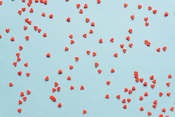 sprinkles background, sugar sprinkle red hearts, decoration for cake and bakery. Top view, flat lay. Valentines holiday