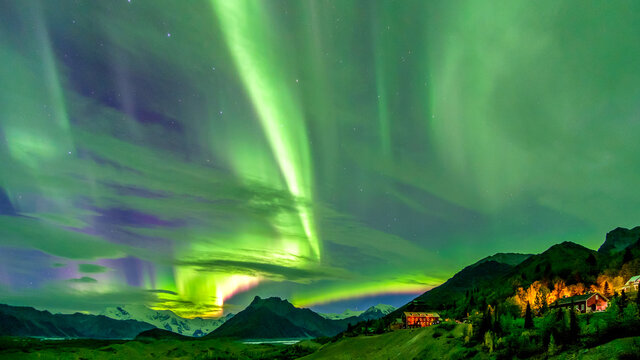 Northern lights over valley. Dancing sky.