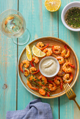 Fried shrimp with thyme, lemon and white sauce. Healthy eating. Diet. Sea food.