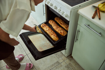 Old woman baking meat pies in kitchen at home © Viacheslav Yakobchuk