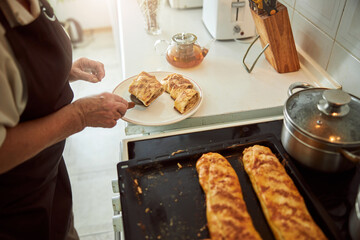 Elderly woman placing piece of meat pie on plate
