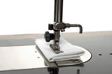 Old vintage sewing machine isolated on white background