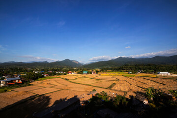 Mountain and rice fields view After harvest on Blue sky
