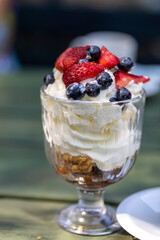 Sweet dessert - meringue with strawberries and blueberries