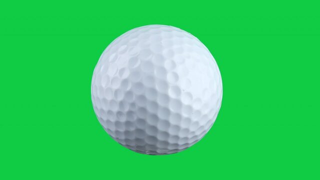 close-up of one golf ball rotating isolated on green screen background