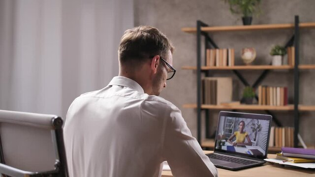 Young man job seeker meeting with african american female HR officer using video conference on laptop. Employer and job applicant communicating via internet, online interview, zoom app