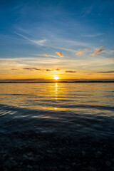 A beautiful sunset behind a lake