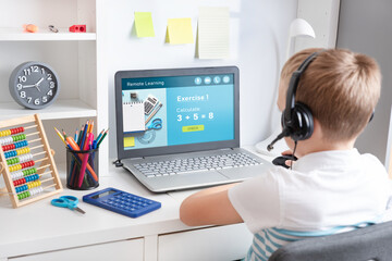Obraz na płótnie Canvas Remote learning concept with boy using laptop