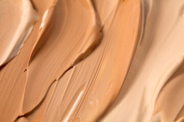 Background of make up liquid foundation strokes. Top view.