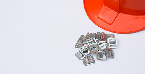 Orange helmet and clapboard brackets isolated on a white background