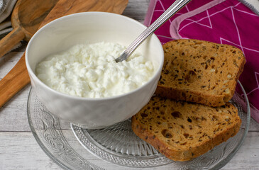 Cottage cheese in a bowl with bread