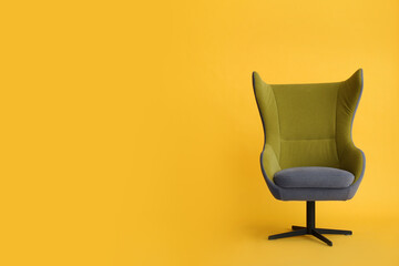 Modern office chair on yellow background. Space for text