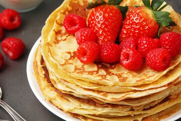 Russian cuisine national dish bliny with fresh berries	