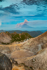 Erupting Sinabung behind the crater of Sibayak vulcano, Sumatra, Indonesia