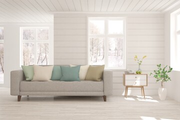 White living room with sofa and winter landscape in window. Scandinavian interior design. 3D illustration