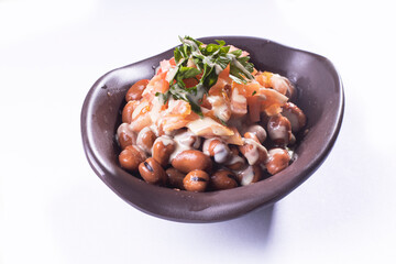 foul or ful Modammas Fava Beans Traditional Dish of Beans for all arab - White background 
