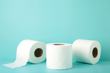 Toilet paper close-up on blue background with copy space