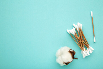 Cotton ear sticks with flower on blue
