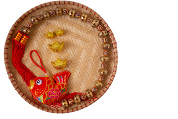 Lunar New Year decoration with lucky gold bar and red fish isolated on white . Tet Holiday.Translation of text appear in image: fortune good luck