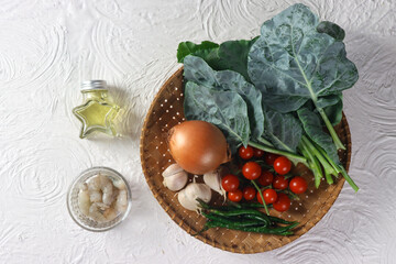 Stir-fried kailan or chinese Kale with shrimp sauce knolling concept