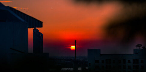 The high angle background of the city view with the secret light of the evening, blurring of night lights, showing the distribution of condominiums, dense homes in the capital community