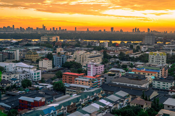 The high angle background of the city view with the secret light of the evening, blurring of night lights, showing the distribution of condominiums, dense homes in the capital community
