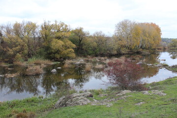 River with large granite stones. Steppe. Nature