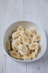 Irisan Pisang. Banana slices in a bowl to make dessert.