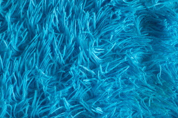 Bright blue wool background. Fleece texture