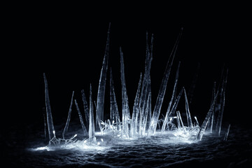 icicles in snow at night