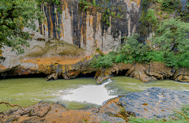 Amazing view of Syntheri Rocks with stream of river Kaneri flowing in cascading effect through...