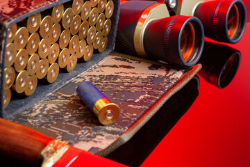 Shotgun cartridges in a cartridge bag in red light close up