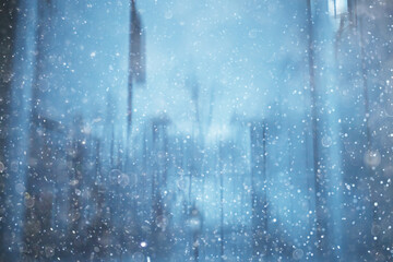 Naklejka na ściany i meble blurred background snowfall nature, abstract falling snowflakes design