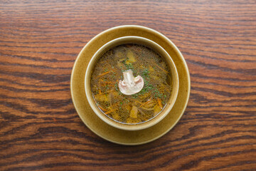 rich mushroom soup with vegetables and herbs