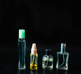 perfume bottles on a black background