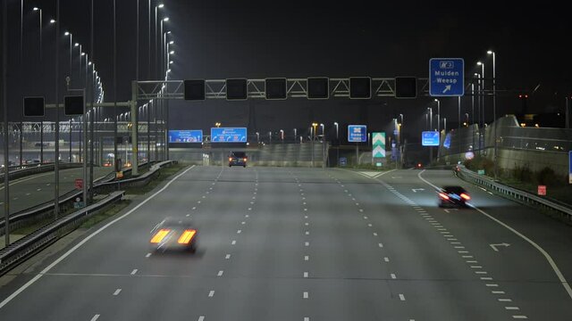 Fast motion shot of light evening traffic on the A1 highway in the Netherlands