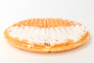 Fototapeta na wymiar Waffles with cream on a white background