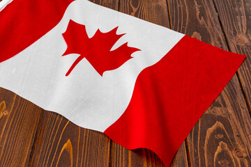 Flag of Canada on wooden background, copy space
