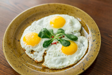 fried eggs-three eggs with herbs