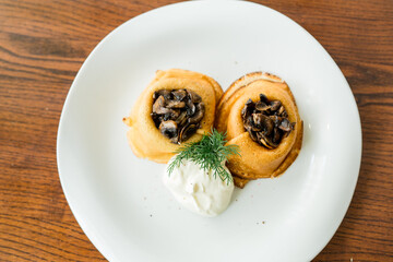 baked pancakes with mushrooms and sour cream