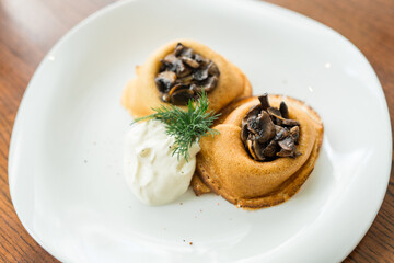 baked pancakes with mushrooms and sour cream