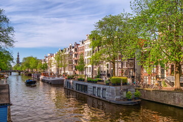 Typical buildings and canal in Amsterdam by day, Netherlands
